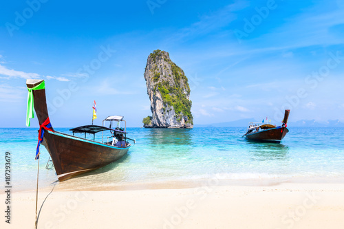 Pristine beach turquoise water longtail boats, Krabi, Thailand travel destination © NicoElNino