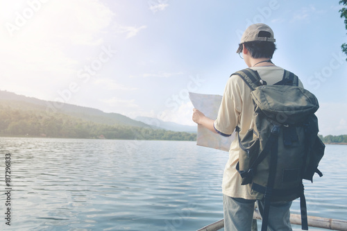 Travel concept,Man on lake and mountains view at holiday time.