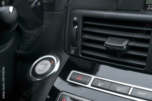 Car hazard warning flashers and emergency button with visible red triangle. selective focus. Automotive part concept. emergency stop button of the car. car interior details © Aleksei