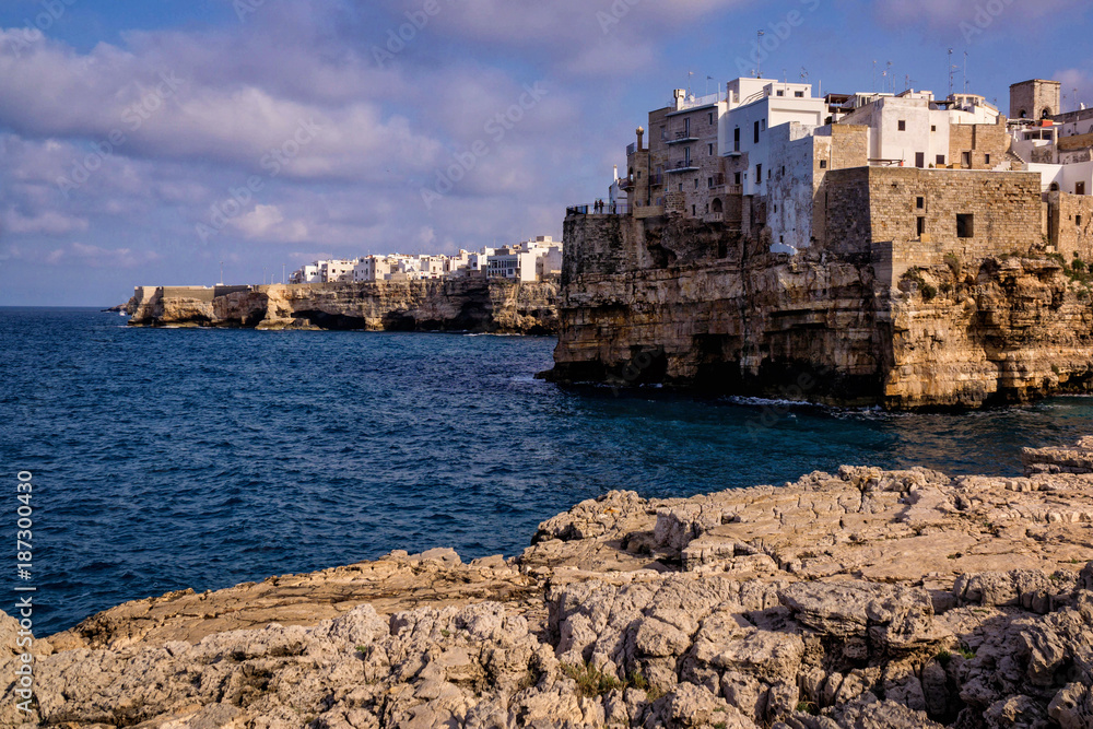 Polignano a Mare, a typical village on the Italian coast of Puglia, with houses built on top of the sea rocks