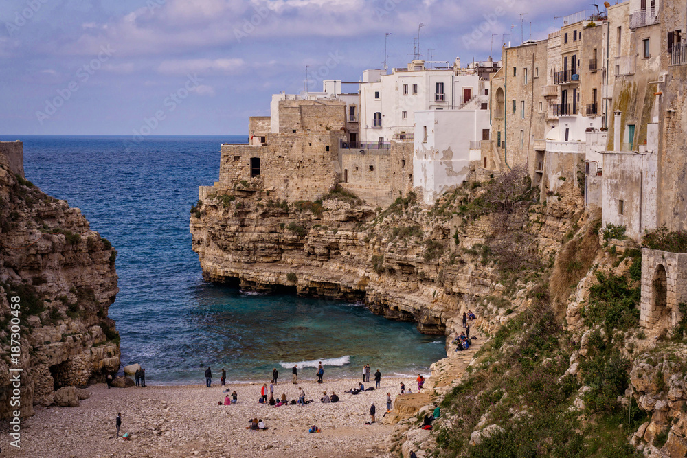 The stunning beach of Polignano a Mare on the Italian coast of Puglia, a small charming village built on top of the sea