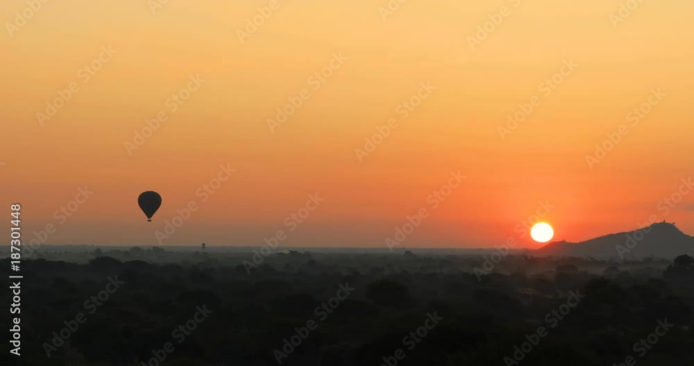 Panoramic view of Bagan historical site in Myanmar (Burma). Hot air balloons fly over ancient temples and Buddhist pagodas Panoramic view of Bagan historical site in Myanmar (Burma). Hot air balloons fly over ancient temples and Buddhist pagodas