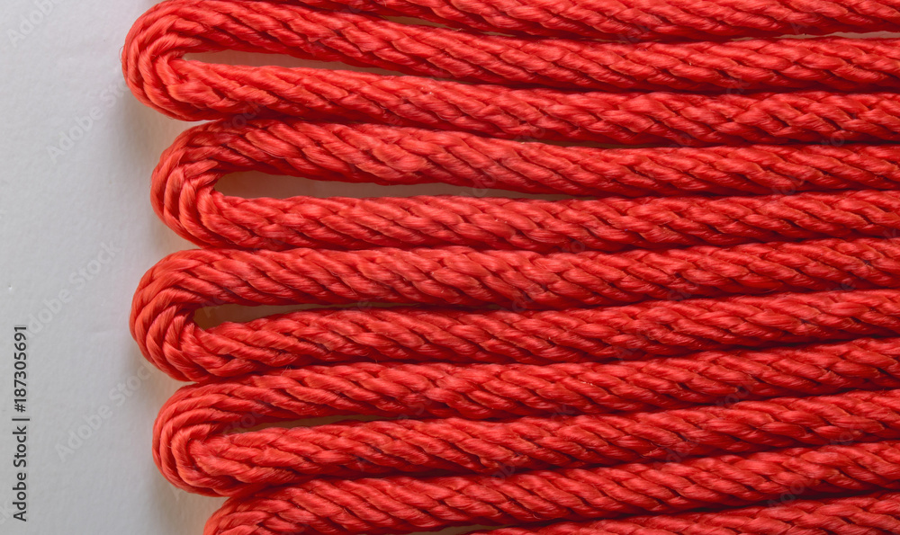 Close up pattern of red rope lines.