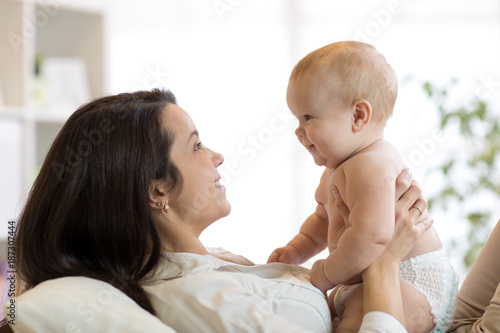 Mother and baby son laughin...