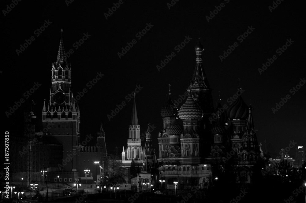 Pokrovsky cathedral and Spasskaya tower at night in low key monochrome, Moscow, Russia