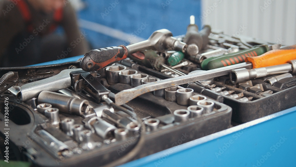 Set of tools in open suitcase