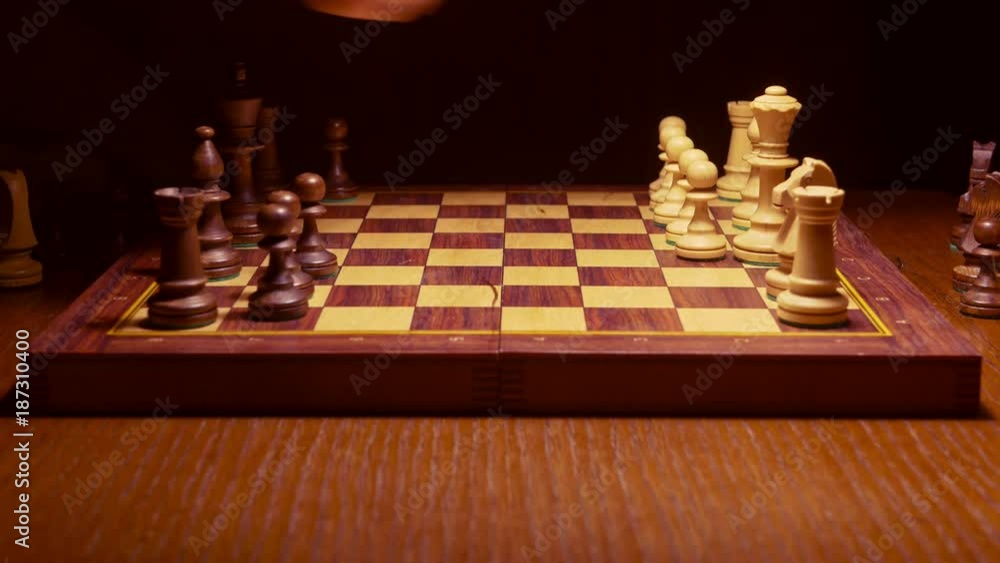 putting chess pieces on the board, ready to play game putting chess pieces on the board, ready to play game