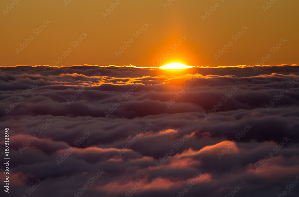 Sunset above the clouds