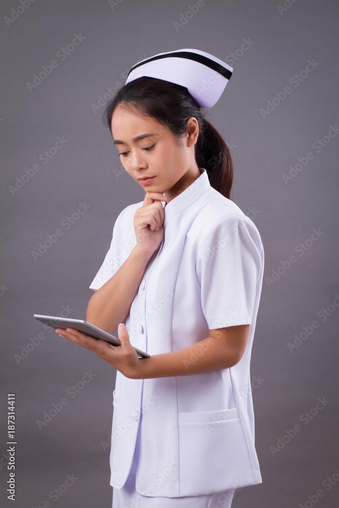 modern nurse using computer tablet, digital patient record concept modern nurse using computer tablet, digital patient record concept