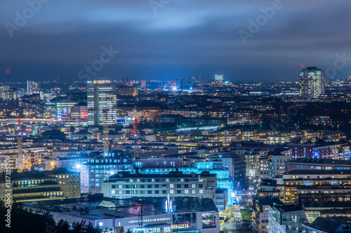 Vy över Hammarbysjöstad och söder på natten photo