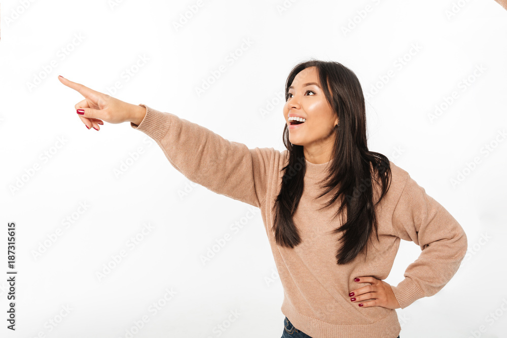 Asian excited shocked lady pointing. Asian excited shocked lady pointing.