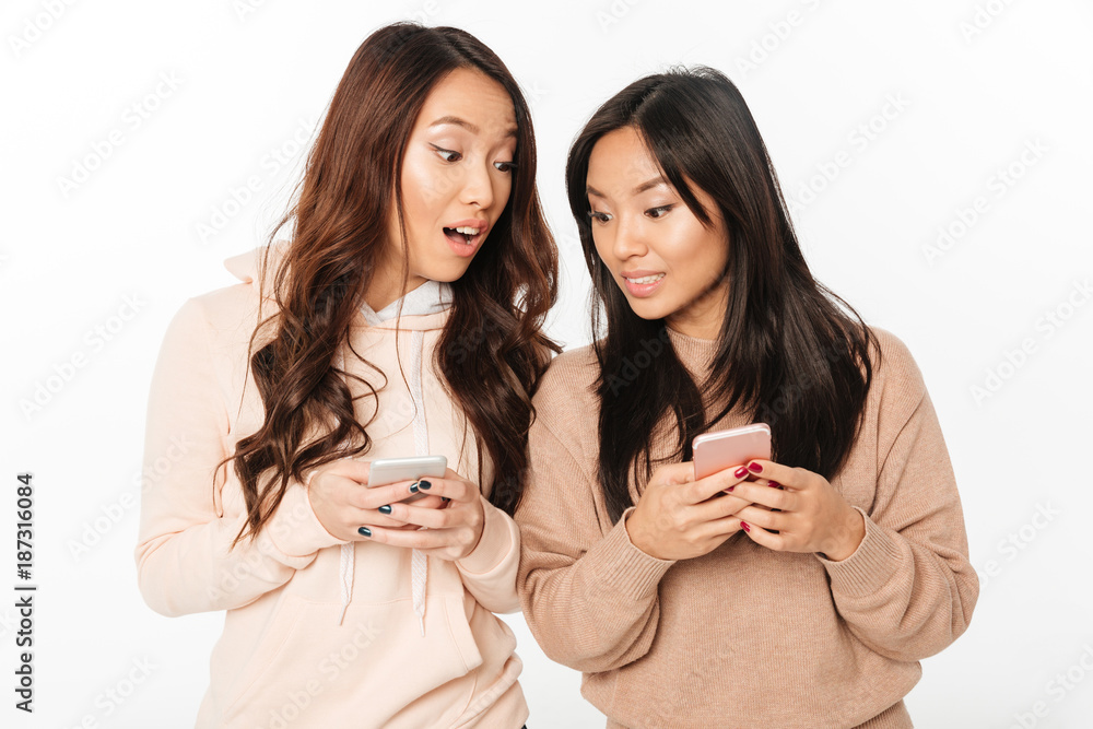 Two asian pretty shocked positive ladies sisters. Two asian pretty shocked positive ladies sisters.