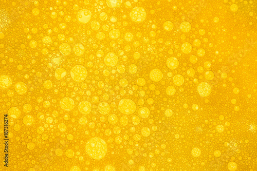 Close up of beer bubbles and foam as a background