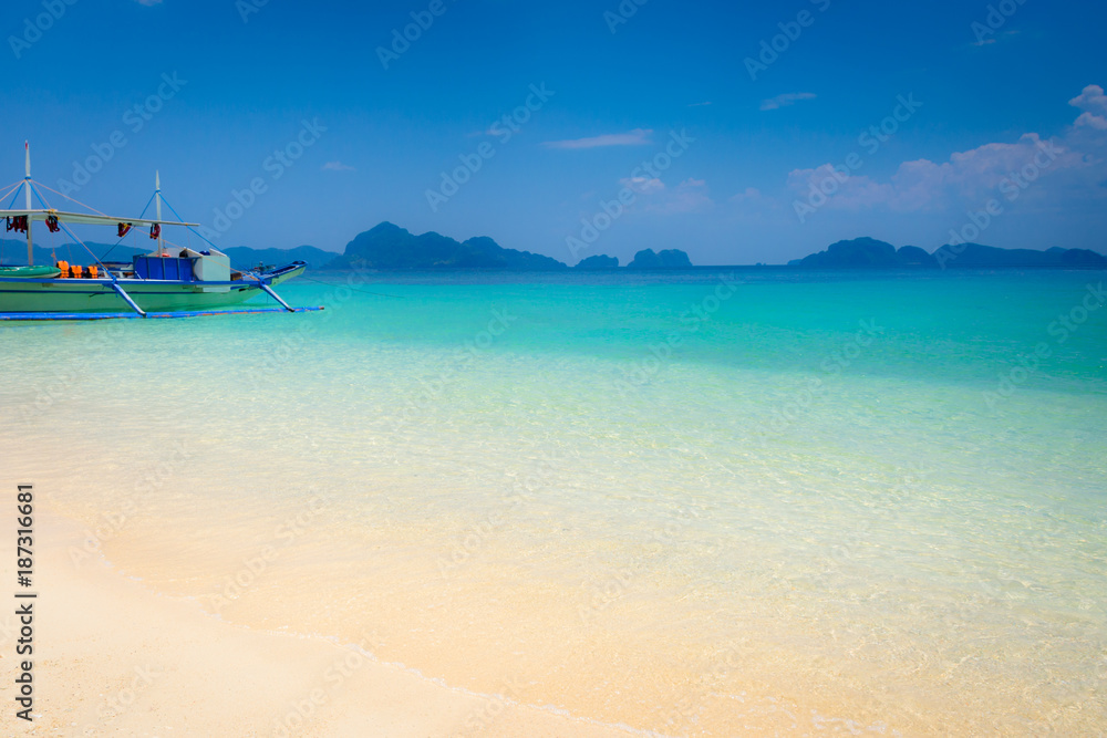 Philippines, El Nido, Palawan , 7 Commandos Beach , sunny coast, traditional boat , turquoise water