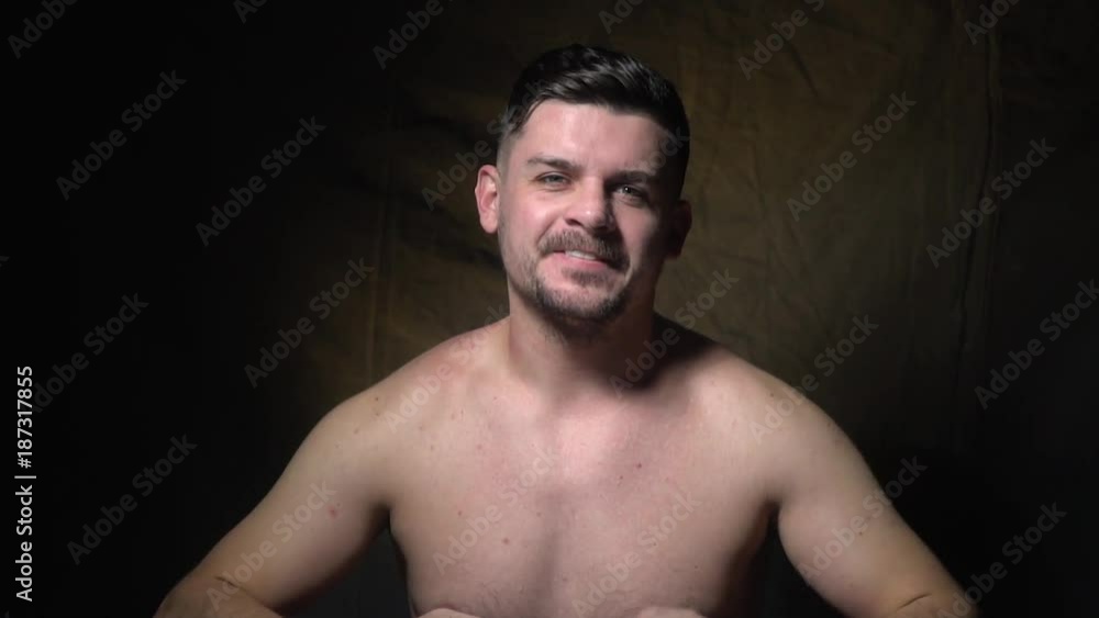 A brutal man punches his hand and shows that he supports you. A brutal man punches his hand and shows that he supports you.