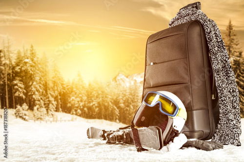 winter time and suitcase on snow space 