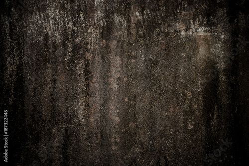 Old concrete wall with black stain.