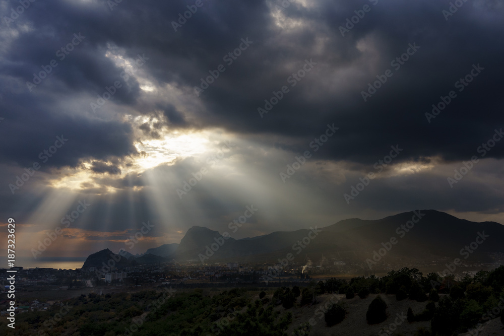 beautiful landscape with dramatic clouds and sun rays