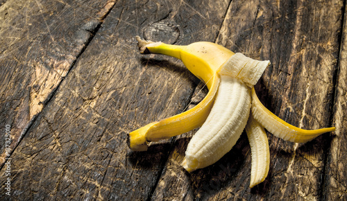 Ripe banana. On wooden background.
