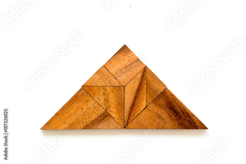 Wood tangram puzzle in triangle shape on white background