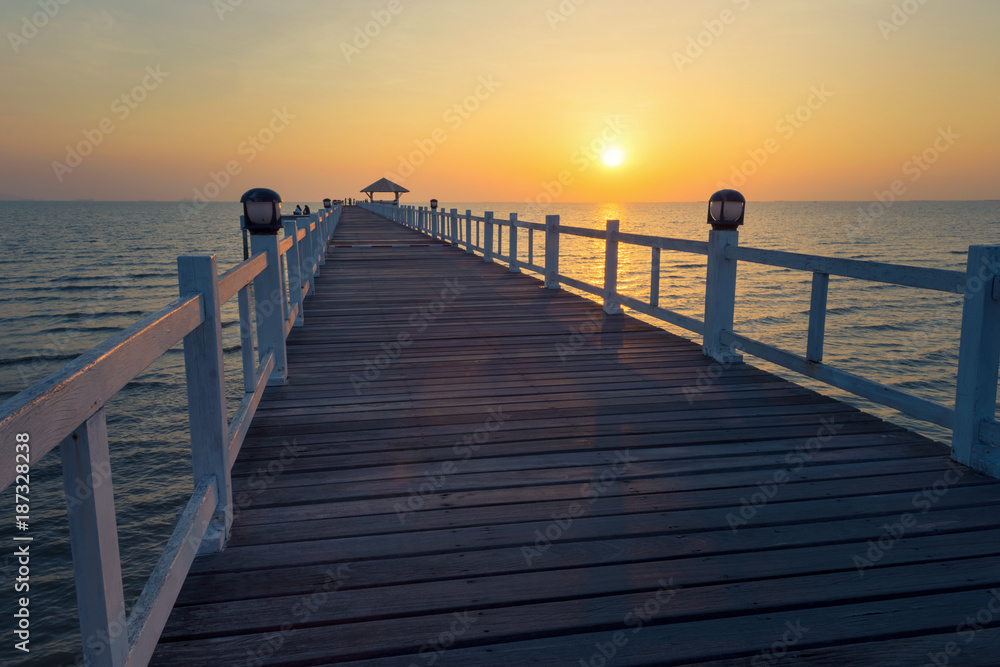 Landscape of Wooded bridge in the port between sunset.