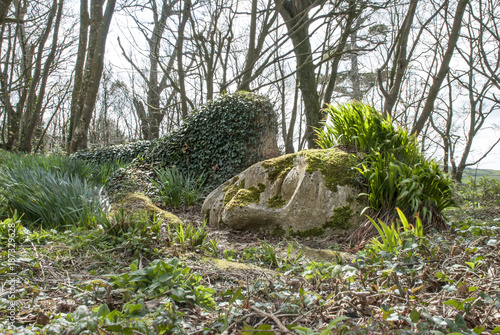 Statue of girl lying on the ground in the lost gardens of Heligan near Mevagissey photo
