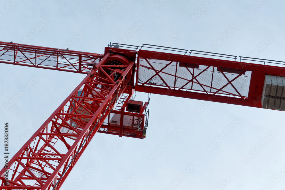 Red high construction crane on a building site, oblique image of an abstract, unengraved image effect
