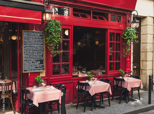 Obraz na płótnie Cozy street with tables of cafe in Paris, France