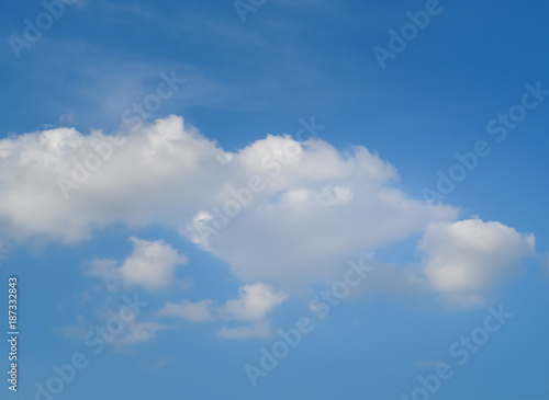 Little clouds on the blue sky background