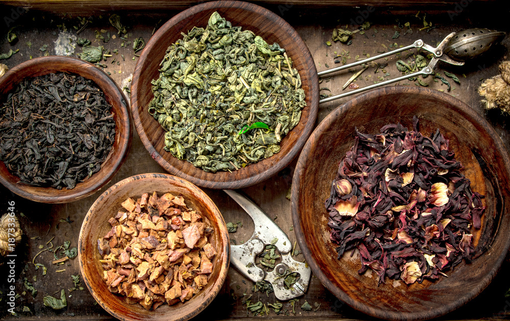 Different kinds of fragrant tea in bowls. Different kinds of fragrant tea in bowls.