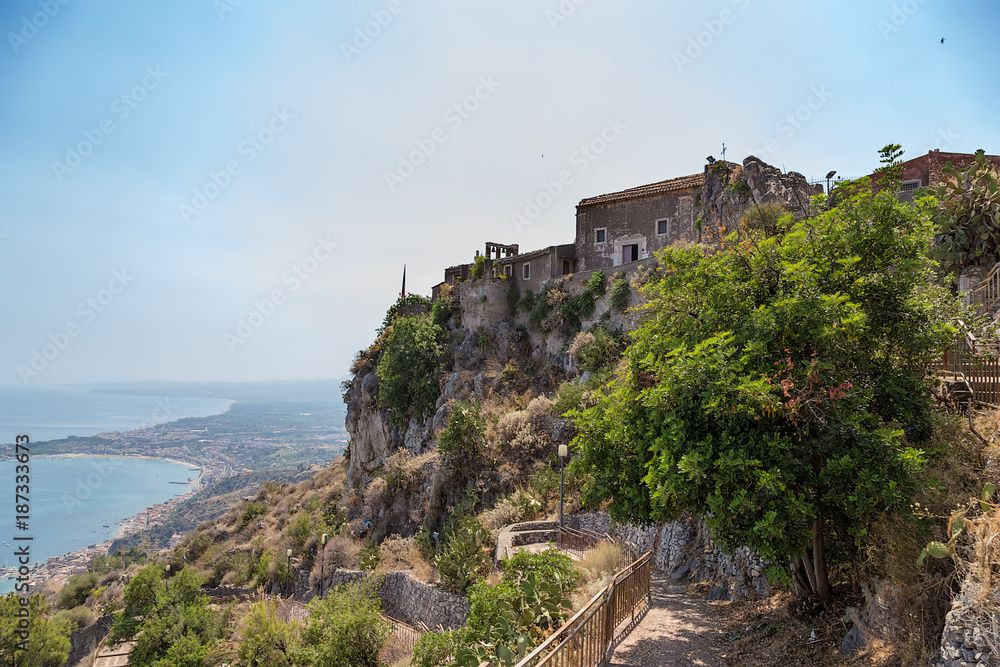 Taormina, Sicily, Italy. Church of Madonna della Rocca, towering above the sea coast.