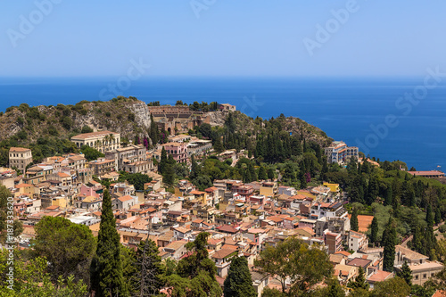 Taormina, Sicily, Italy. View of the historic center of the city and the ruins of the ancient Greek theater from a height