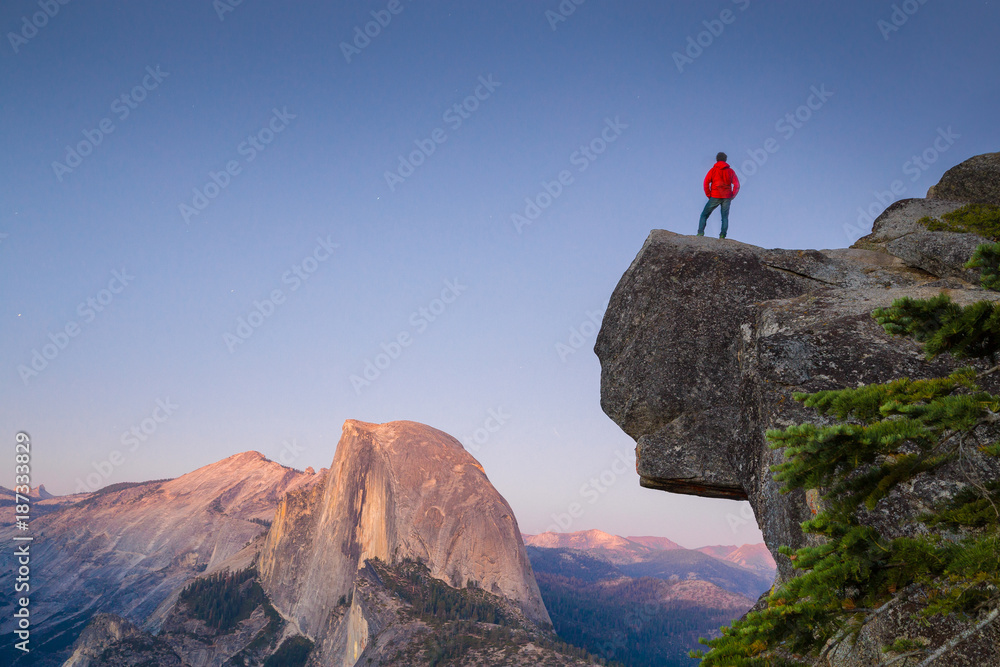 Fototapeta premium Hiker in Yosemite National Park at sunset, California, USA