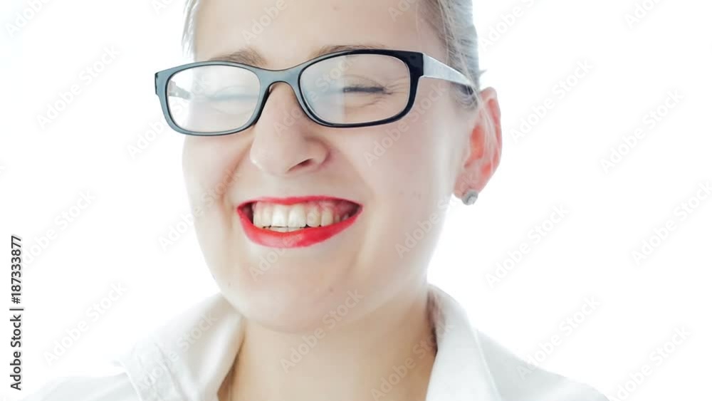 Slow motion video of happy laughing woman with red lipstick wearing eyeglasses Slow motion video of happy laughing woman with red lipstick wearing eyeglasses