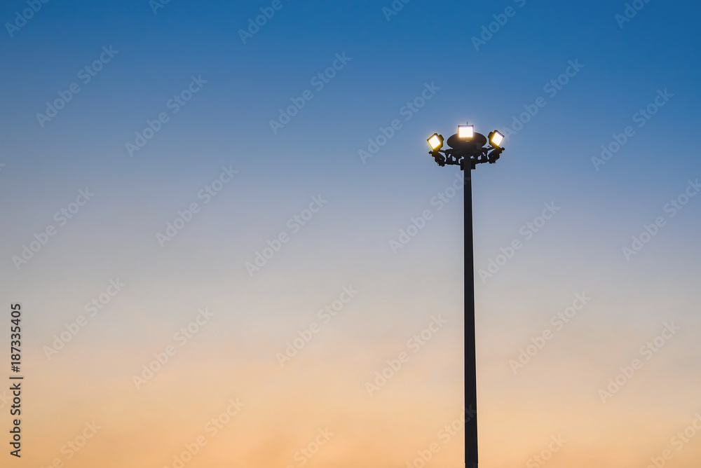 Pillar spotlights and light in evening.