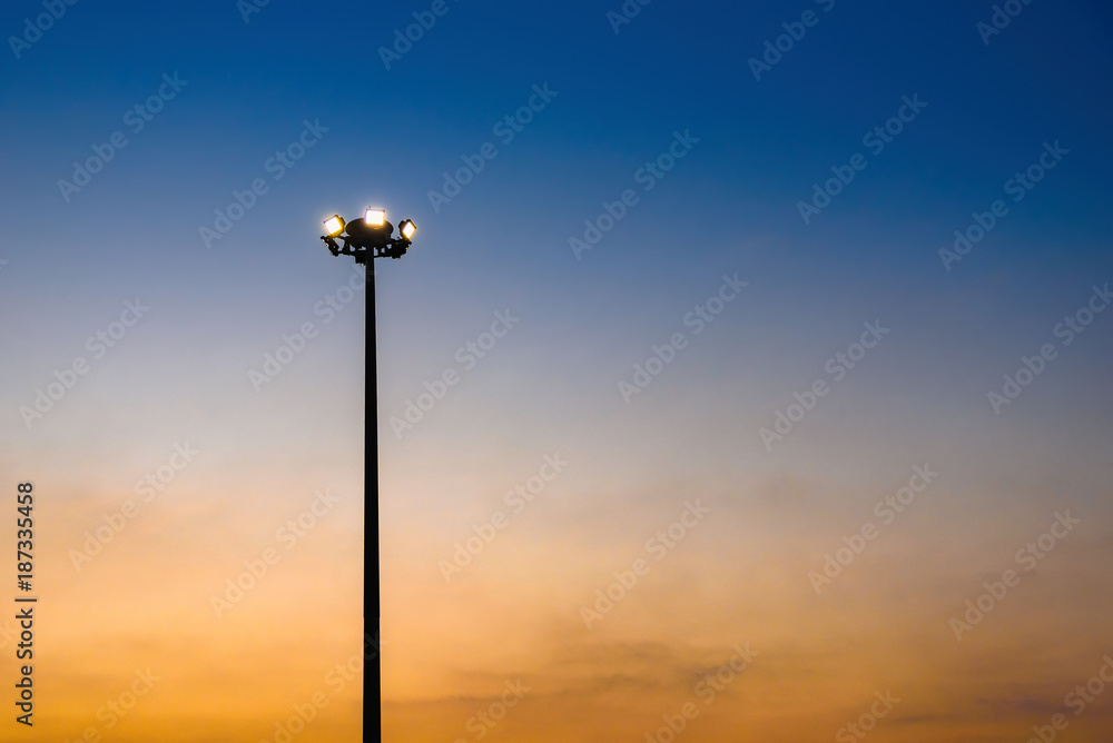 Pillar spotlights and light in evening.