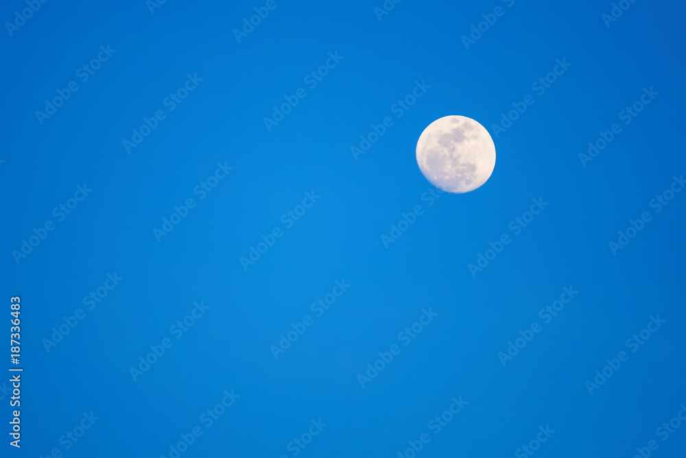 The moon on the blue sky. Evening's shot. The moon on the blue sky. Evening's shot.