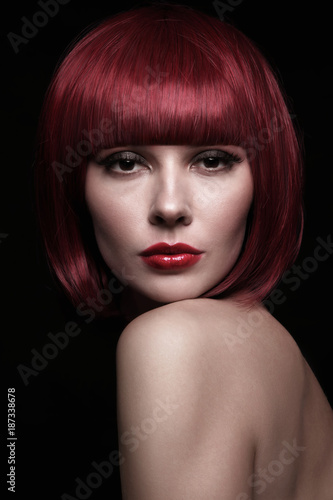 Portrait of young beautiful sexy redhead woman with stylish bob haircut
