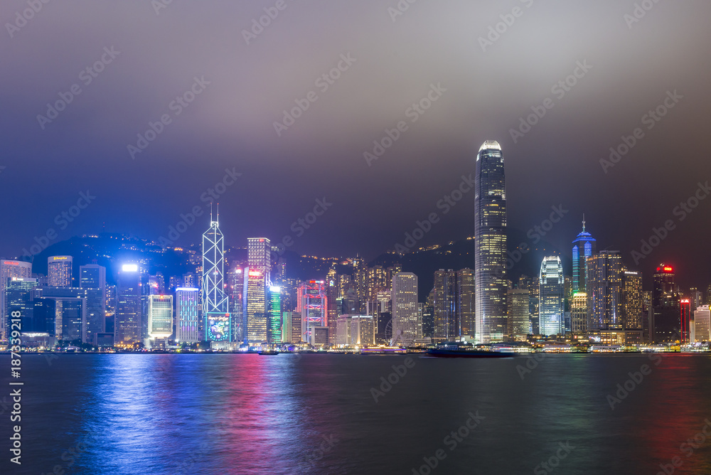 HONG KONG - NOVEMBER 19, 2017: Night scene of Hong Kong skyline at Victoria harbour. HONG KONG - NOVEMBER 19, 2017: Night scene of Hong Kong skyline at Victoria harbour.
