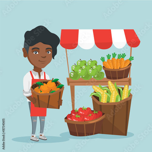 Young african-american street seller selling fruits and vegetables. Street seller standing near the market stall and holding a basket of oranges. Vector cartoon illustration. Square layout.