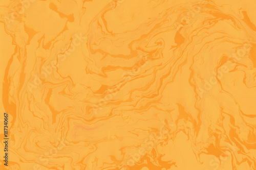 Suminagashi marble texture hand painted with orange ink. Digital paper 747 performed in traditional japanese suminagashi floating ink technique. Wonderful liquid abstract background.