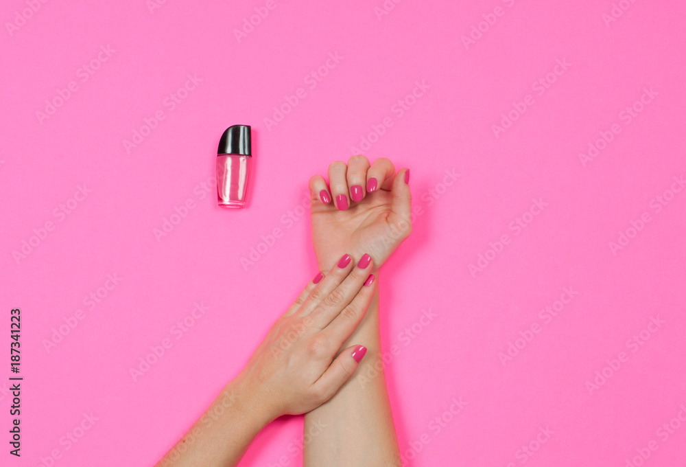 Nail salon. Beautiful female hands with pink nail polish Nail salon. Beautiful female hands with pink nail polish