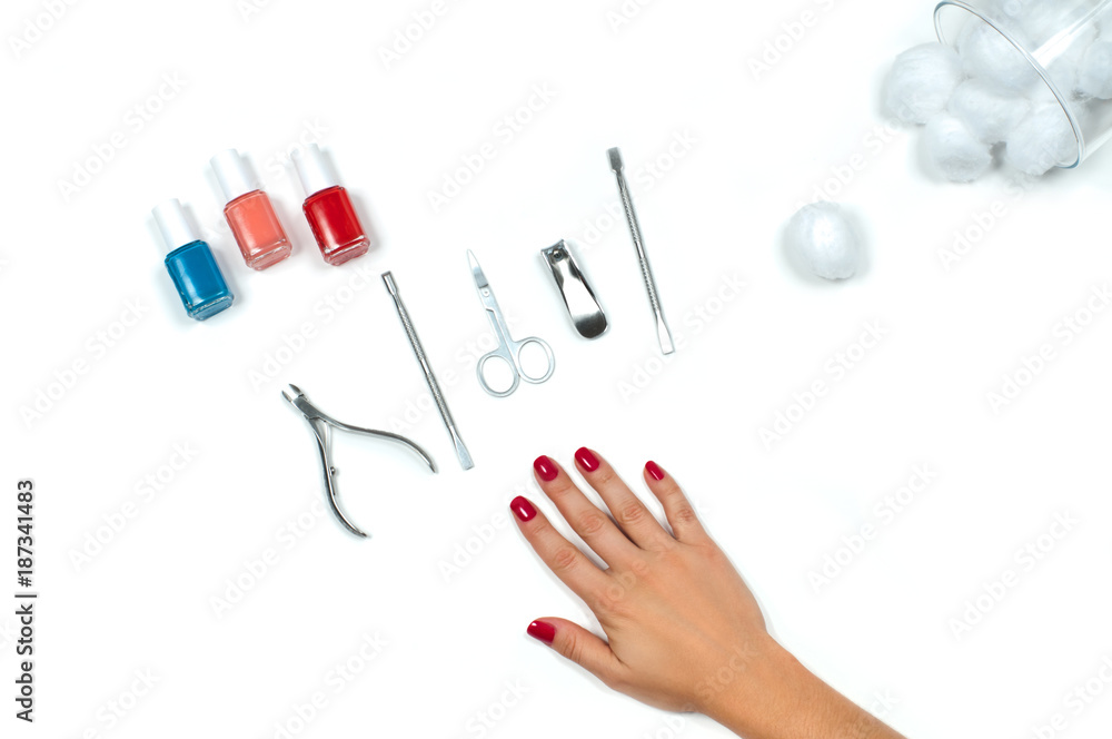 Fototapeta premium Beautiful female hand with red manicure