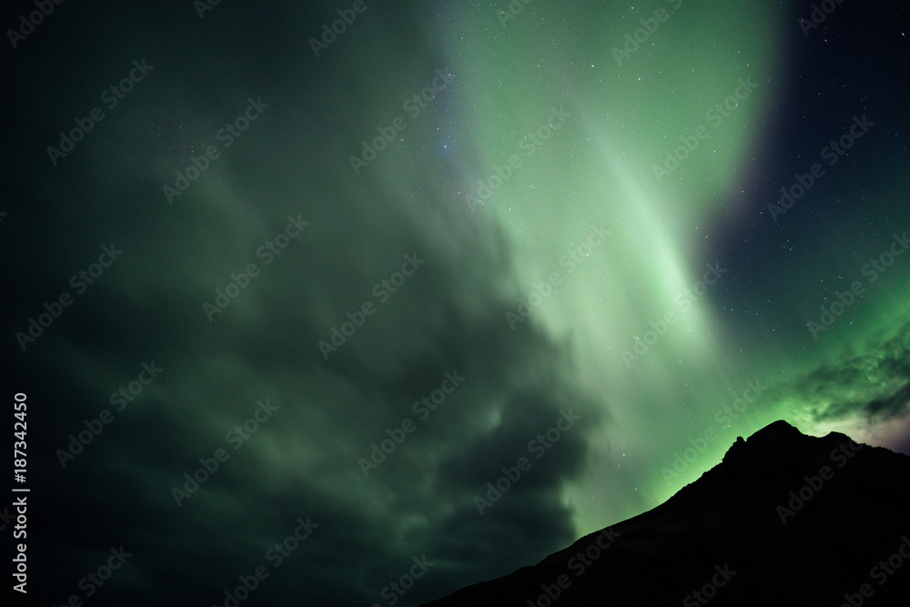 Aurora Borealis over a Mountain in Iceland