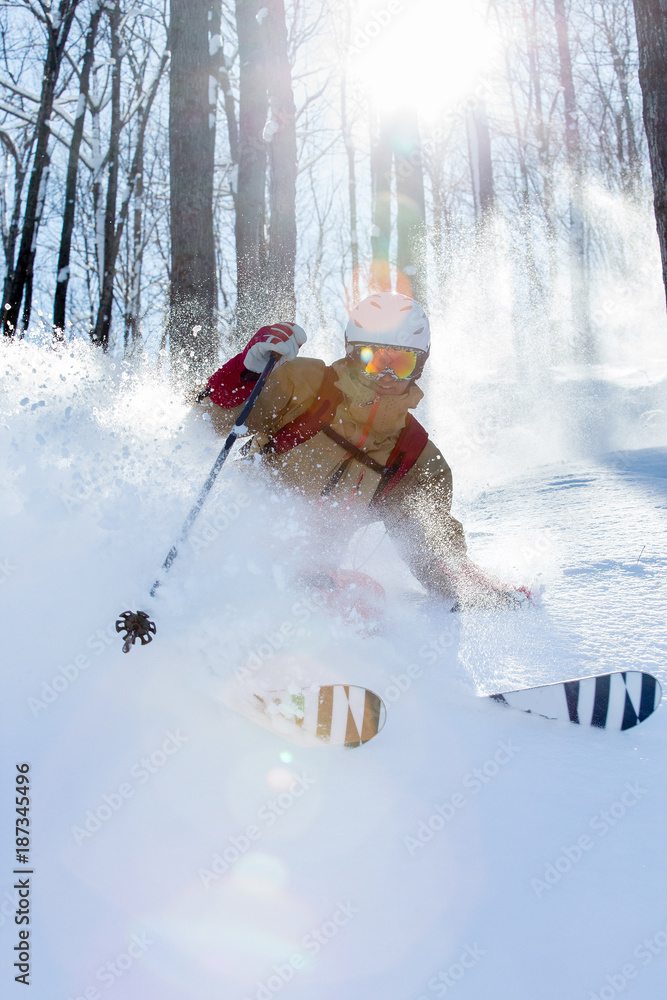 Man skiing powder snow in Ontario, Canada