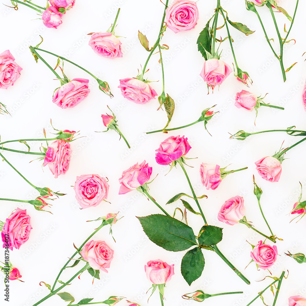 Floral pattern with pink roses, branches and leaves on white background. Flat lay, Top view. Woman day.