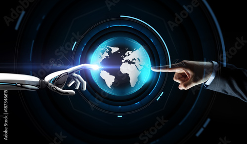 human and robot hand with virtual earth hologram