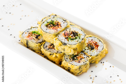 Tempura maki sushi - deep fried hot sushi roll with salmon  tuna  eel  chukka and sesame