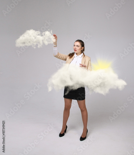 Woman with cloud and sun. Concept on the topic of computer cloud services.
