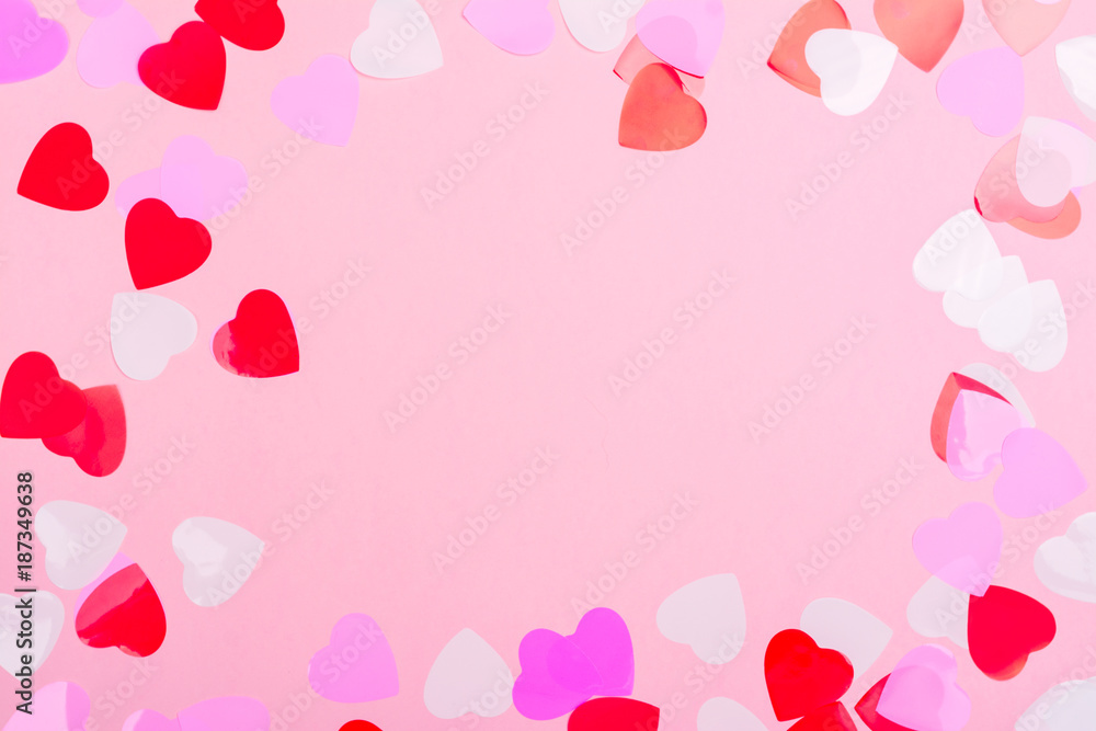 Decorative hearts confetti on pink background